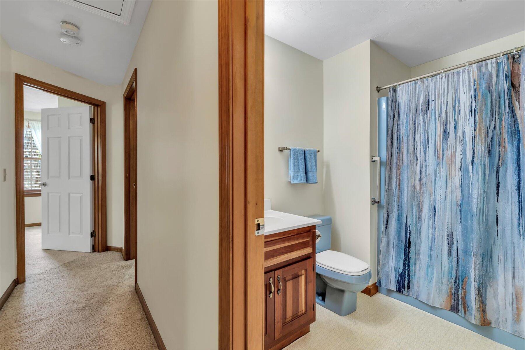 18 Pheasant Run Road Harwich, MA 02645 - Photo 23 of 51 a bathroom with a toilet a sink and a large mirror