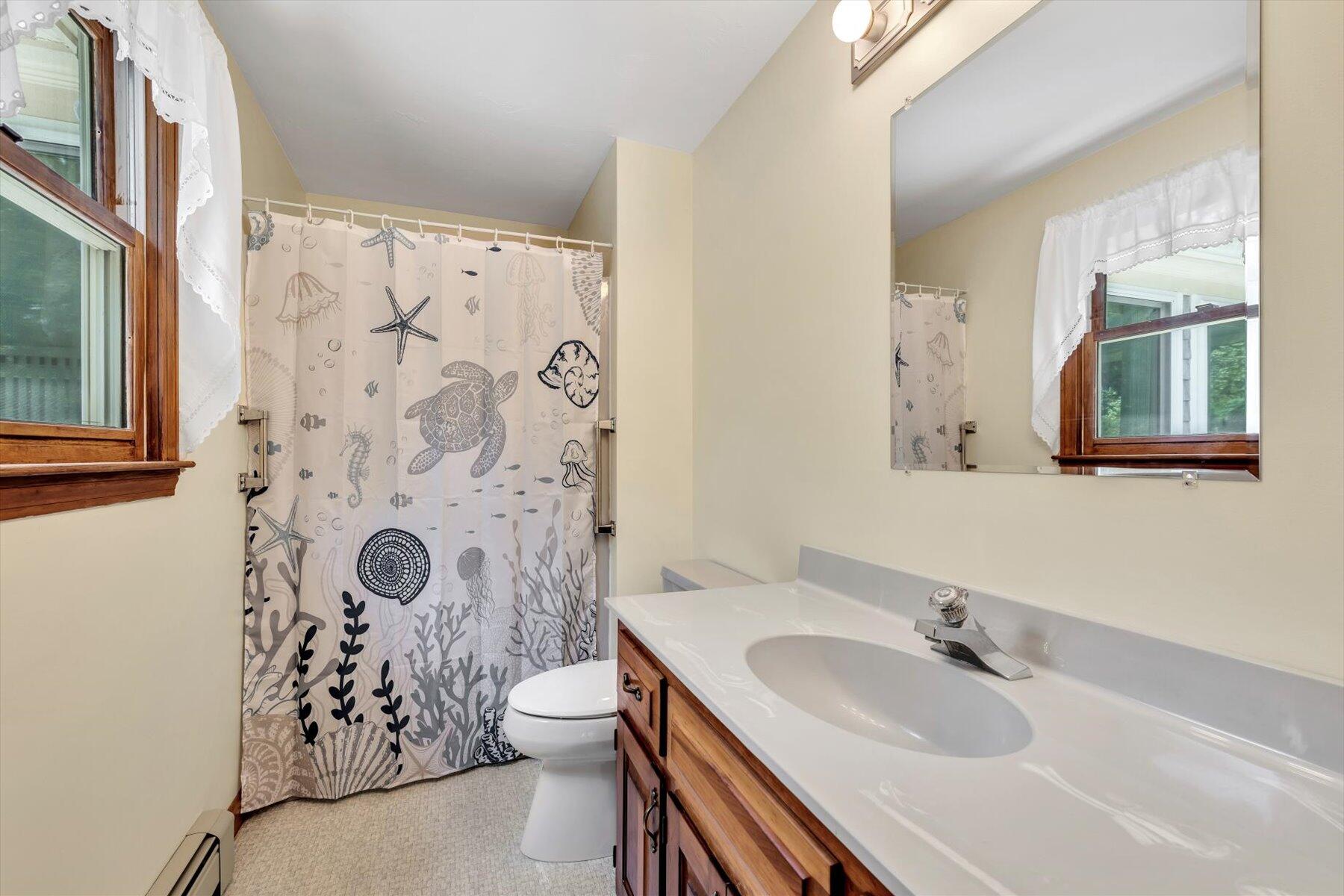 18 Pheasant Run Road Harwich, MA 02645 - Photo 28 of 51 a bathroom with a sink toilet and shower