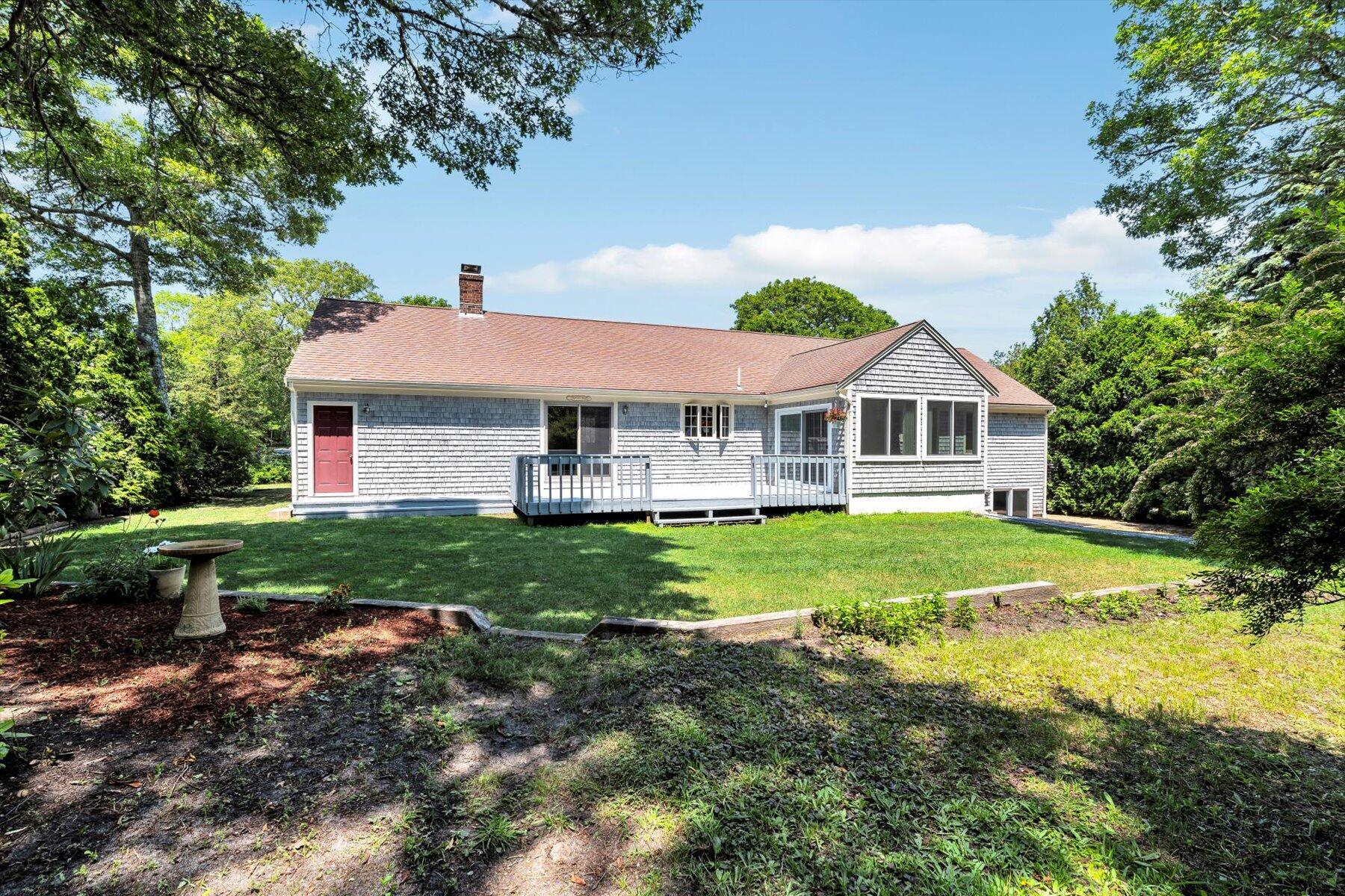 18 Pheasant Run Road Harwich, MA 02645 - Photo 41 of 51 a front view of a house with yard and green space