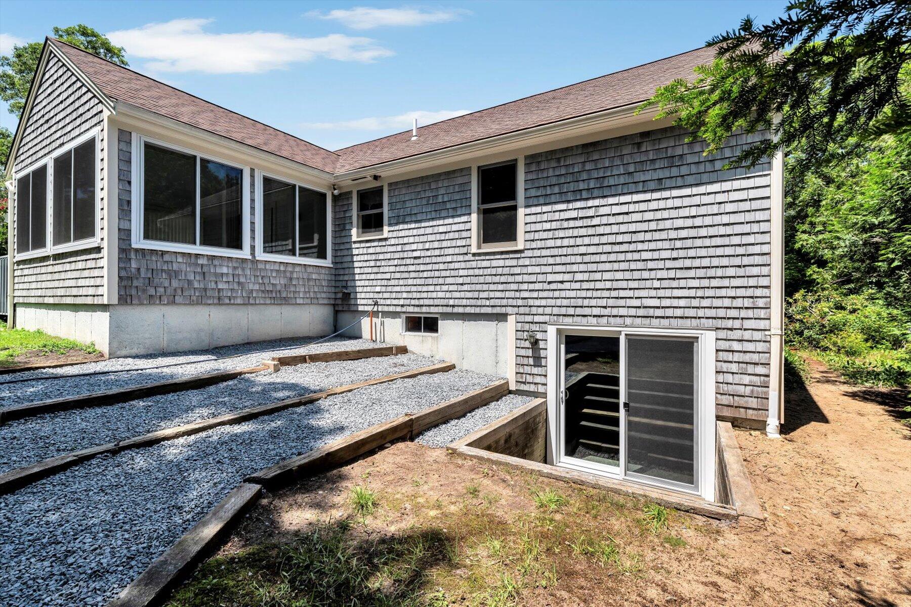 18 Pheasant Run Road Harwich, MA 02645 - Photo 43 of 51 a front view of a house with a yard