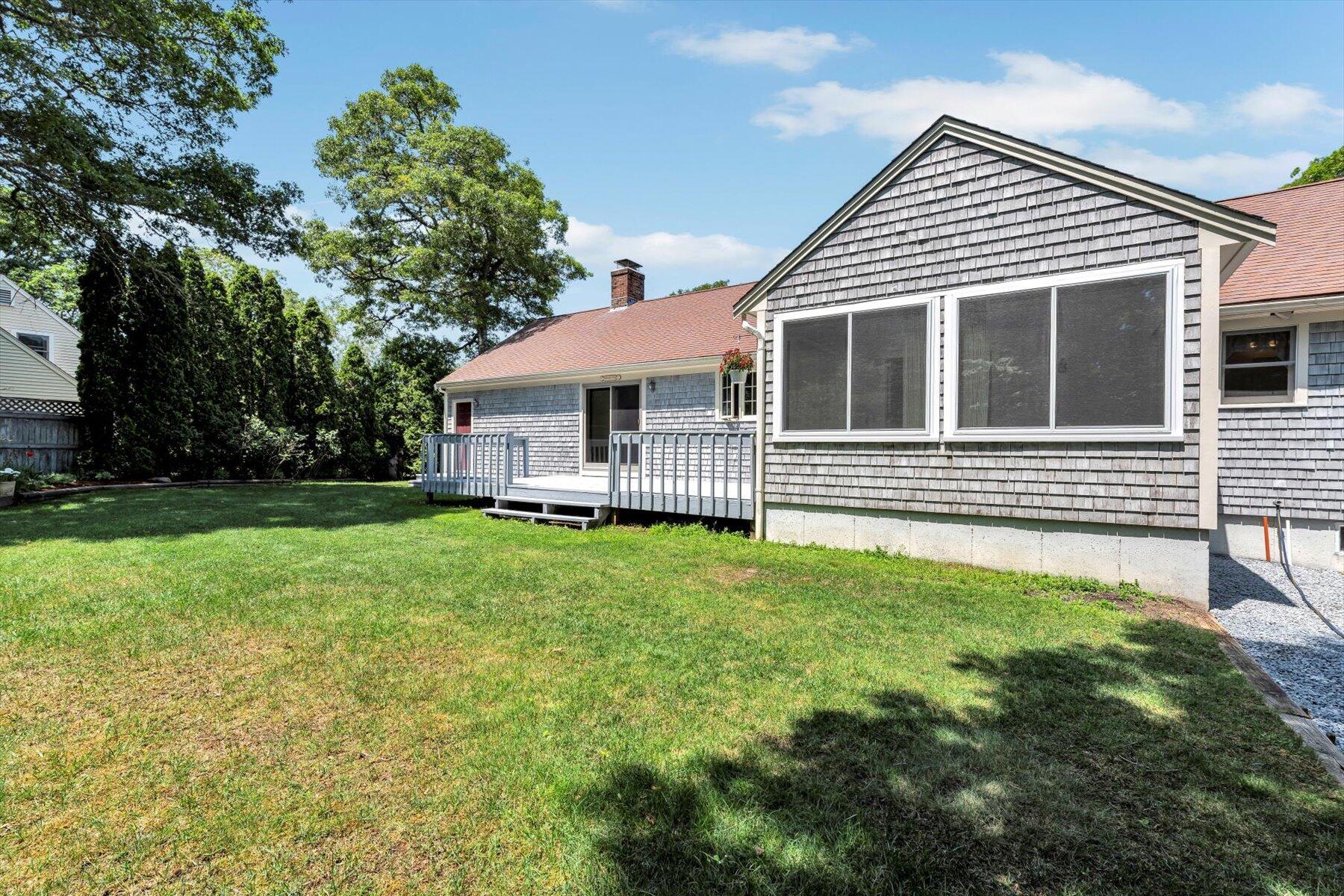 18 Pheasant Run Road Harwich, MA 02645 - Photo 44 of 51 a front view of a house with a garden