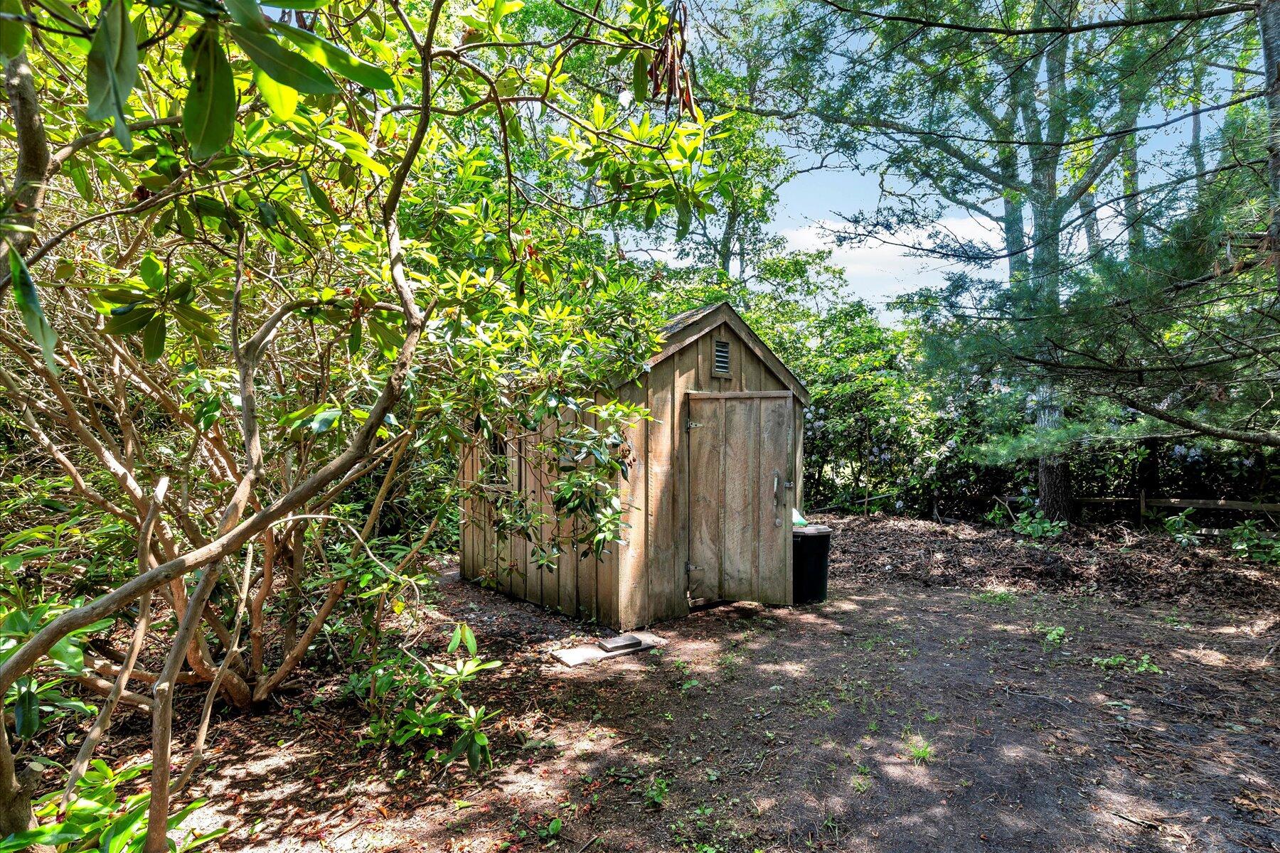 18 Pheasant Run Road Harwich, MA 02645 - Photo 45 of 51 a view of a dry yard with plants and large trees