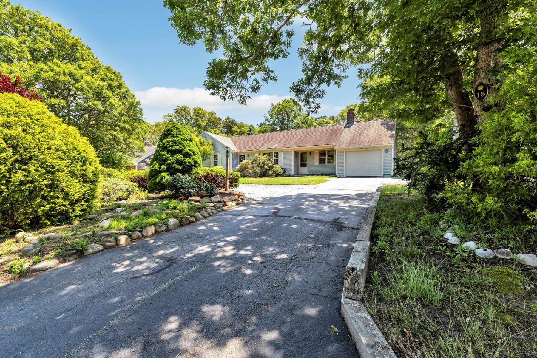 18 Pheasant Run Road Harwich, MA 02645 - Photo 46 of 51 a view of a house with a yard and large trees