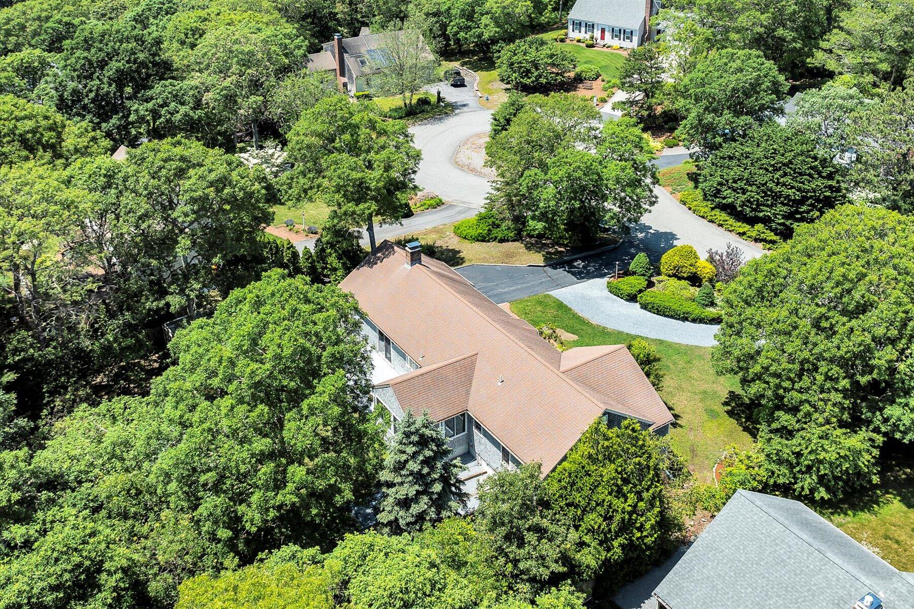 18 Pheasant Run Road Harwich, MA 02645 - Photo 48 of 51 an aerial view of a house with a yard and lake view