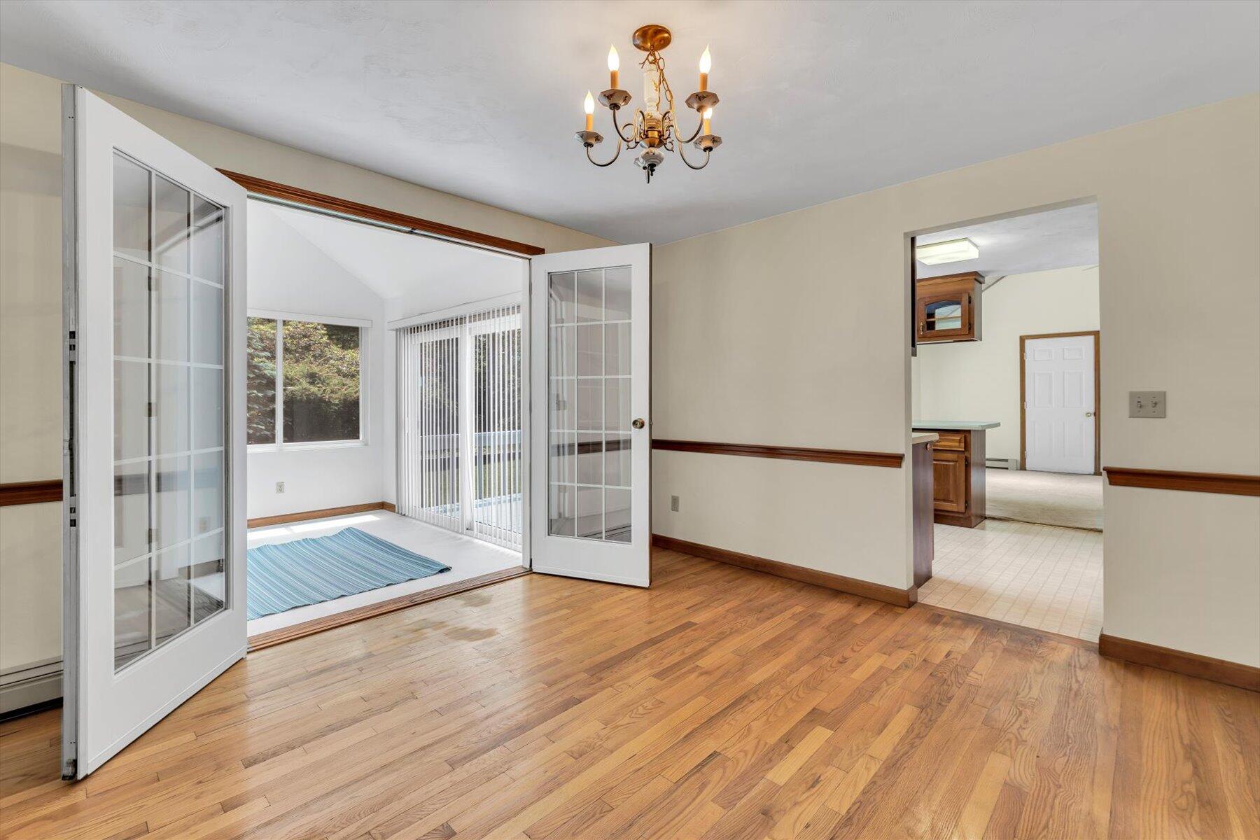 18 Pheasant Run Road Harwich, MA 02645 - Photo 9 of 51 a view of a big room with wooden floor and windows