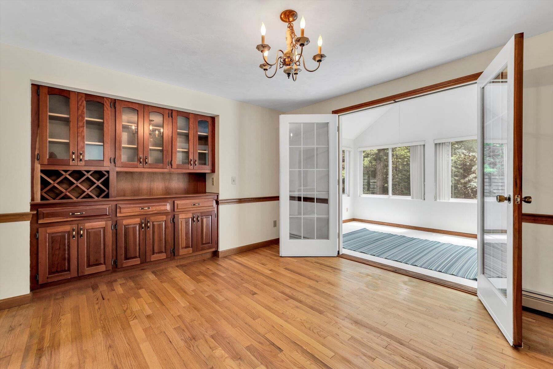 18 Pheasant Run Road Harwich, MA 02645 - Photo 10 of 51 a kitchen with stainless steel appliances a large counter top a stove and a wooden floors