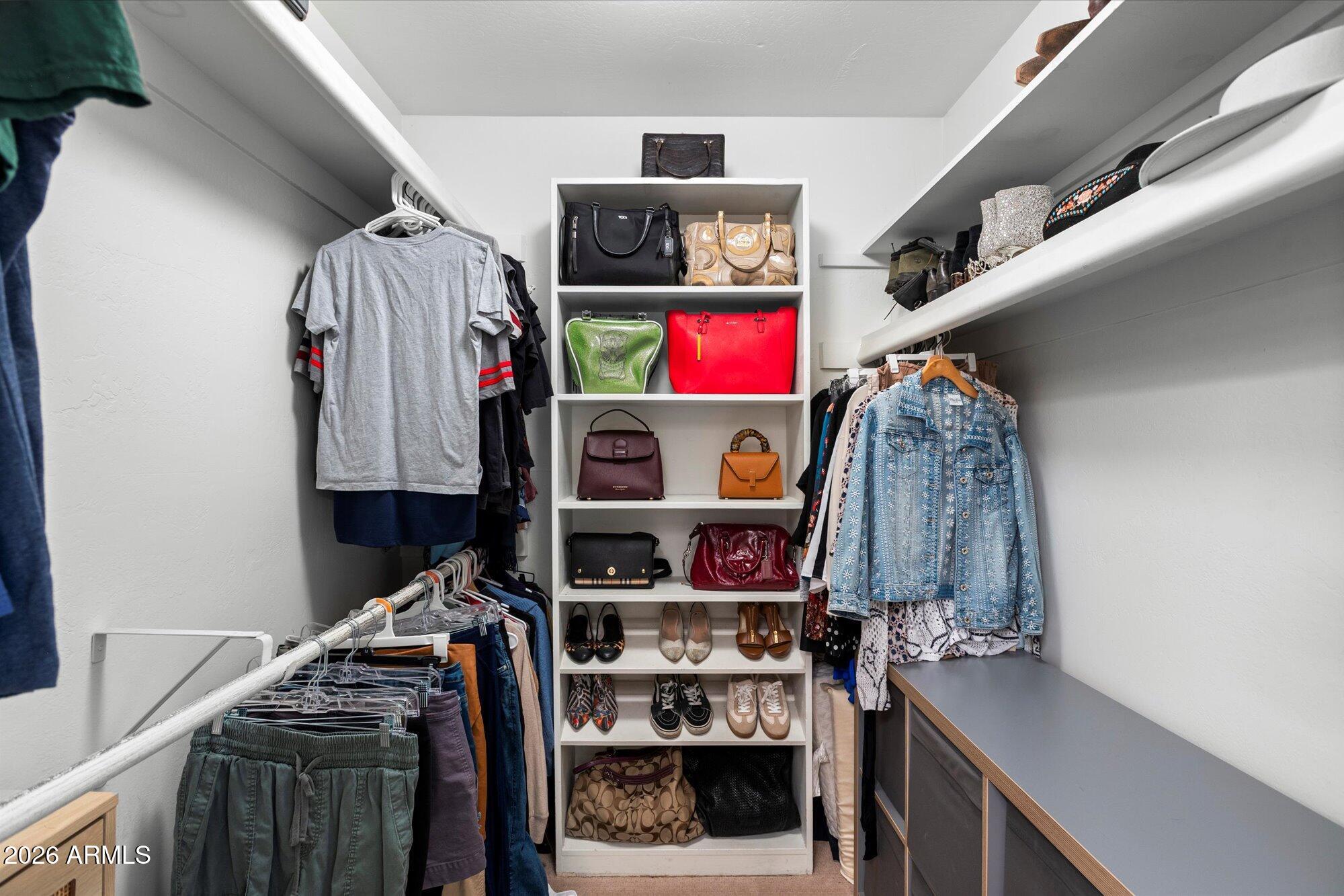 7005 North Barbados Place Phoenix, AZ 85021 - Photo 26 of 42 a view of walk in closet with clothes and shoes