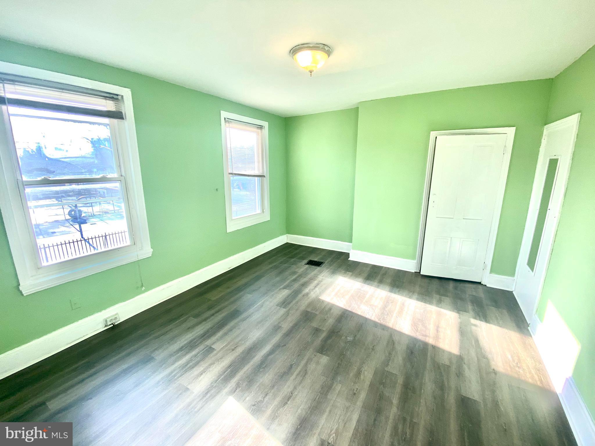 1107 West Colona Street Philadelphia, PA 19133 - Photo 2 of 10 a view of empty room with window and hardwood