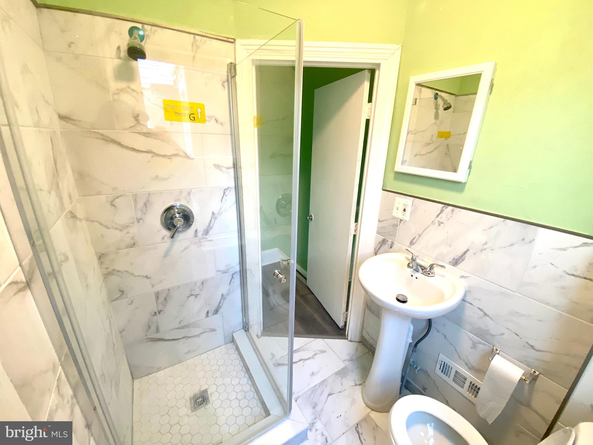 1107 West Colona Street Philadelphia, PA 19133 - Photo 3 of 10 a bathroom with a sink and toilet