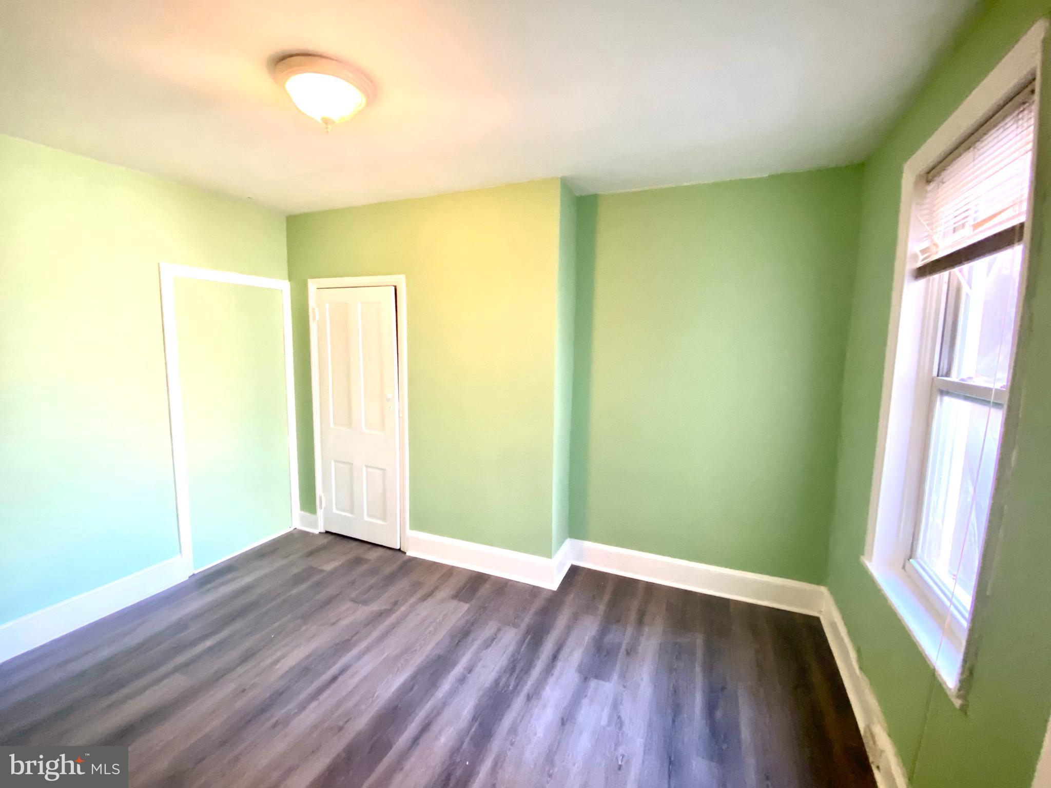 1107 West Colona Street Philadelphia, PA 19133 - Photo 4 of 10 a view of empty room with wooden floor and fan