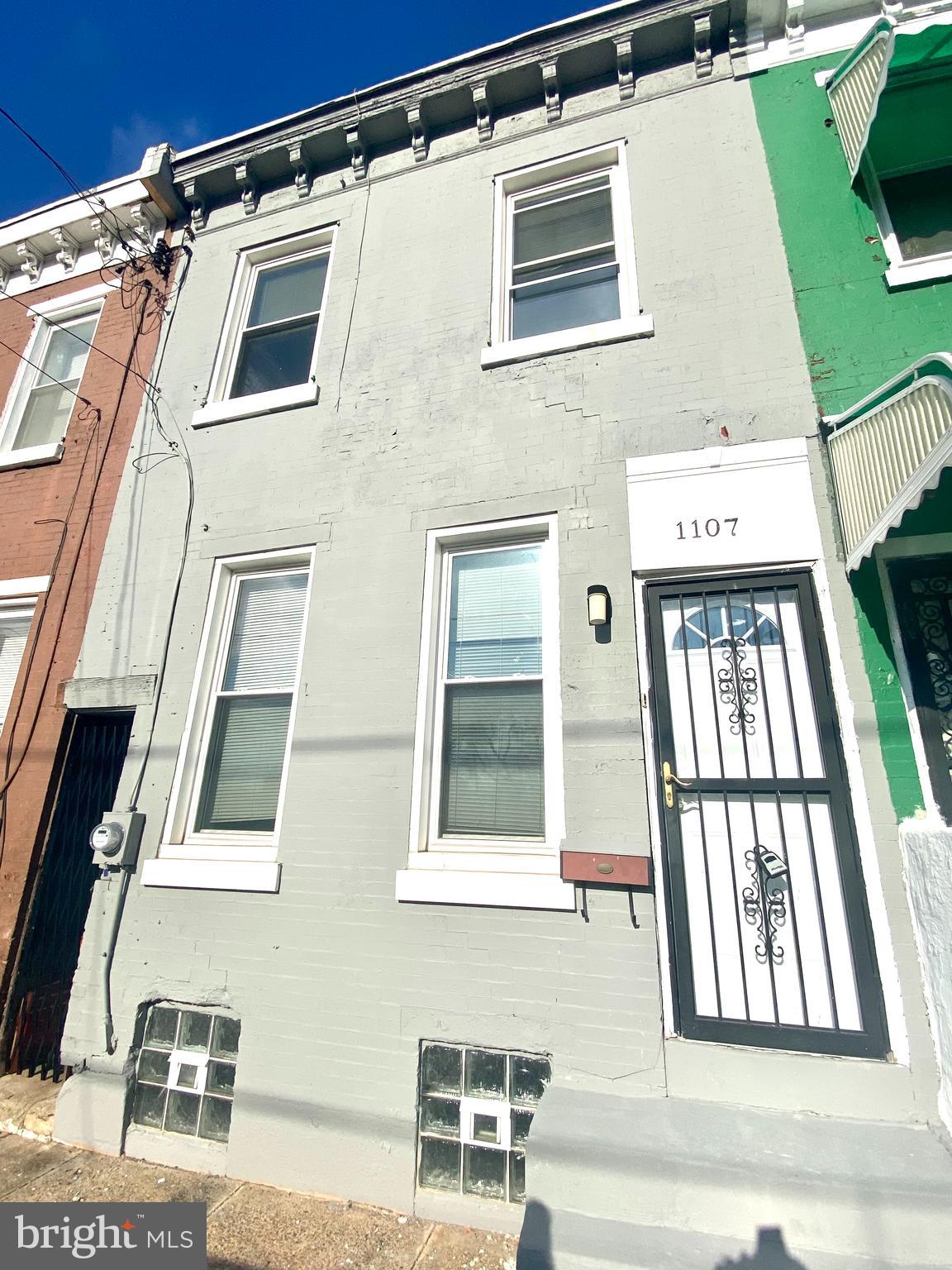 1107 West Colona Street Philadelphia, PA 19133 - Photo 10 of 10 a front view of a multi story residential apartment building