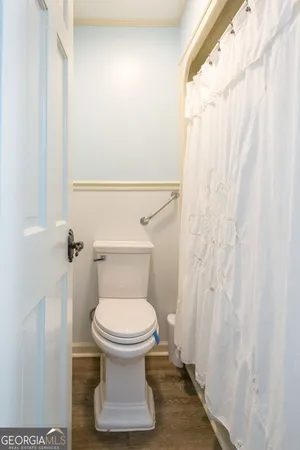 an empty room with wooden floor