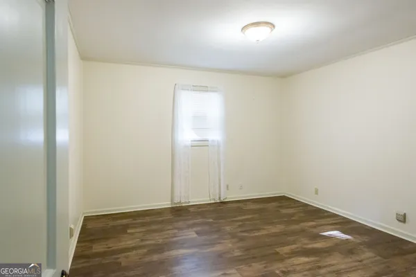 a view of walk in closet with white walls