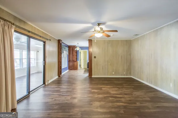 a view of a refrigerator in kitchen and wooden floor