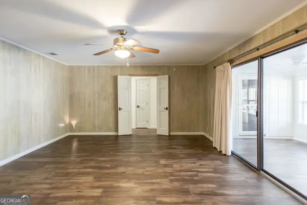 a kitchen with stainless steel appliances granite countertop a sink a refrigerator and a window