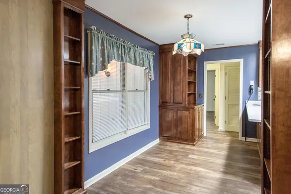 a kitchen with stainless steel appliances granite countertop a sink refrigerator and microwave