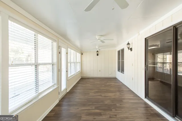 a view of large house with a large tree in front of it