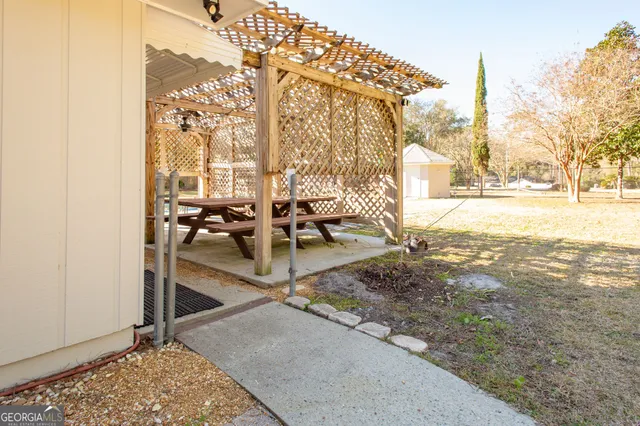 a view of a yard with trees