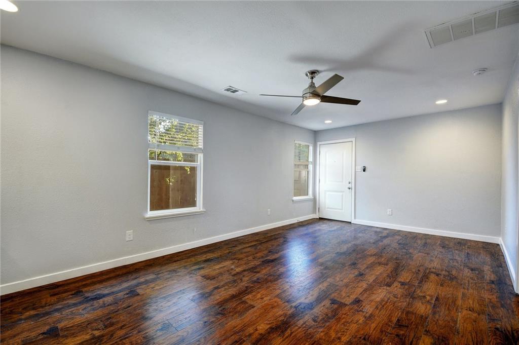 1120 Estes Avenue, Unit B Austin, TX 78721 - Photo 18 of 26 Empty room featuring recessed lighting, dark wood-style floors, and ceiling fan