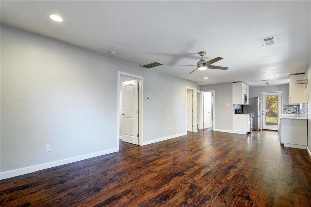 1120 Estes Avenue, Unit B Austin, TX 78721 - Photo 20 of 26 Unfurnished living room featuring recessed lighting, dark wood-style flooring, and ceiling fan