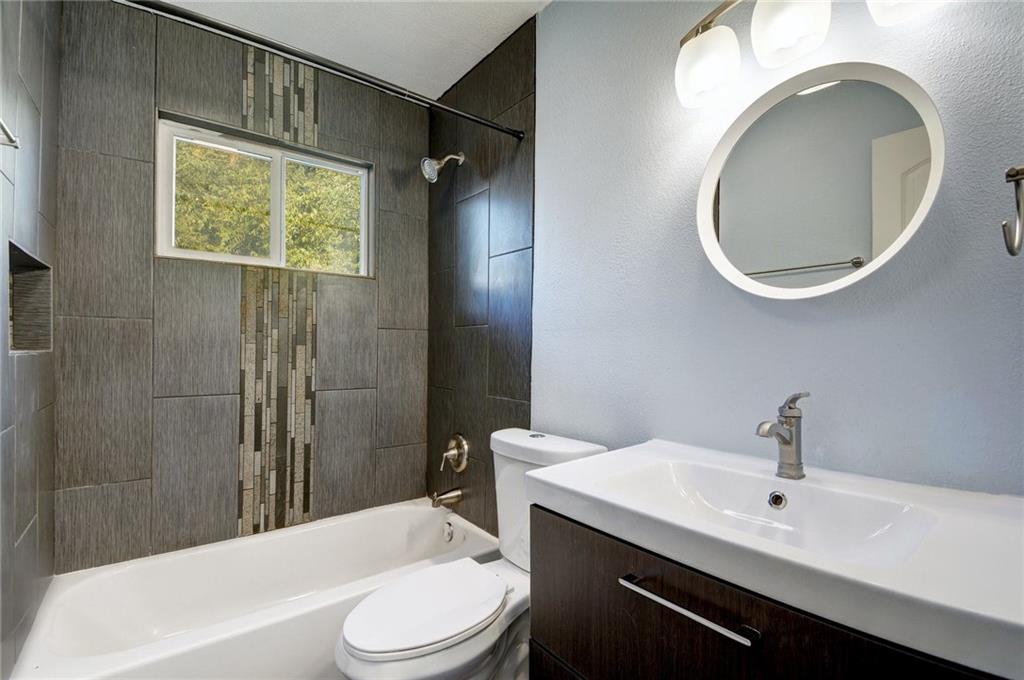 1120 Estes Avenue, Unit B Austin, TX 78721 - Photo 9 of 26 Full bathroom with vanity and bathtub / shower combination