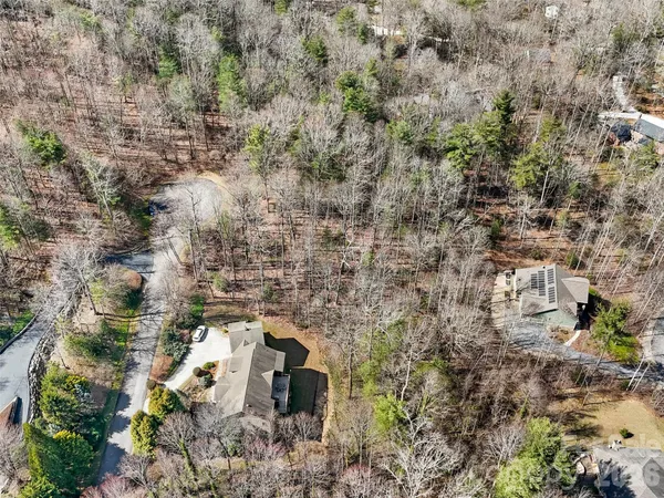 a aerial view of a house with a yard