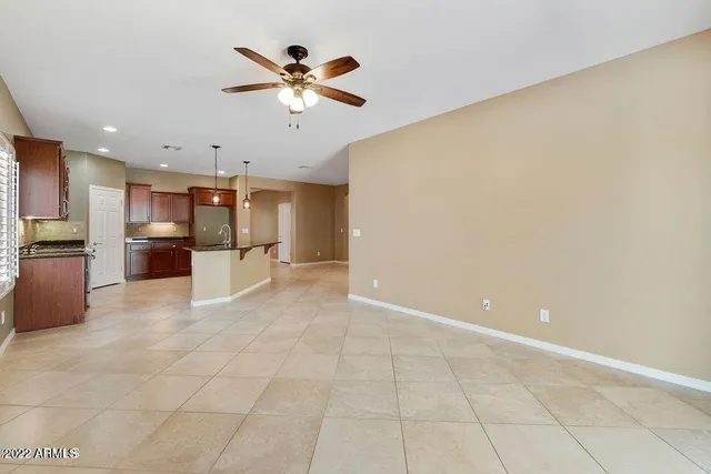 a view of a kitchen with a sink and a refrigerator