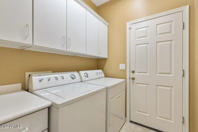 a utility room with dryer and washer