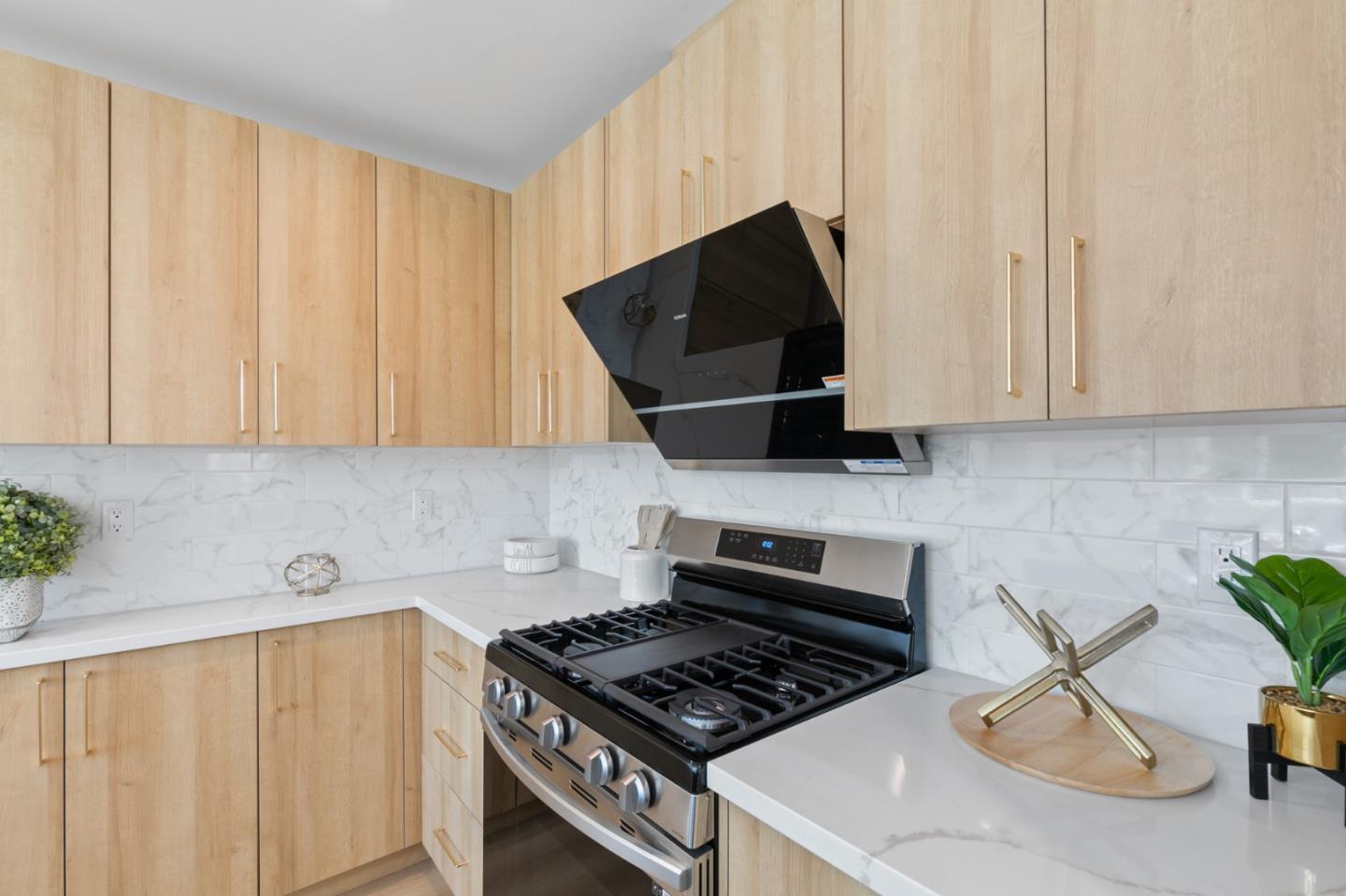 1381 Hampton Drive Sunnyvale, CA 94087 - Photo 14 of 28 a kitchen with stainless steel appliances a stove a microwave a sink and cabinets