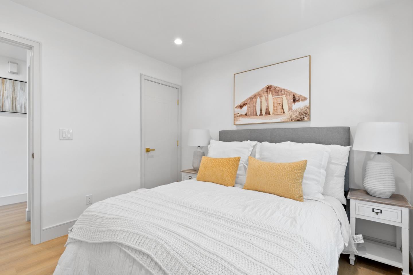 1381 Hampton Drive Sunnyvale, CA 94087 - Photo 20 of 28 a bedroom with a large bed and a painting on the wall