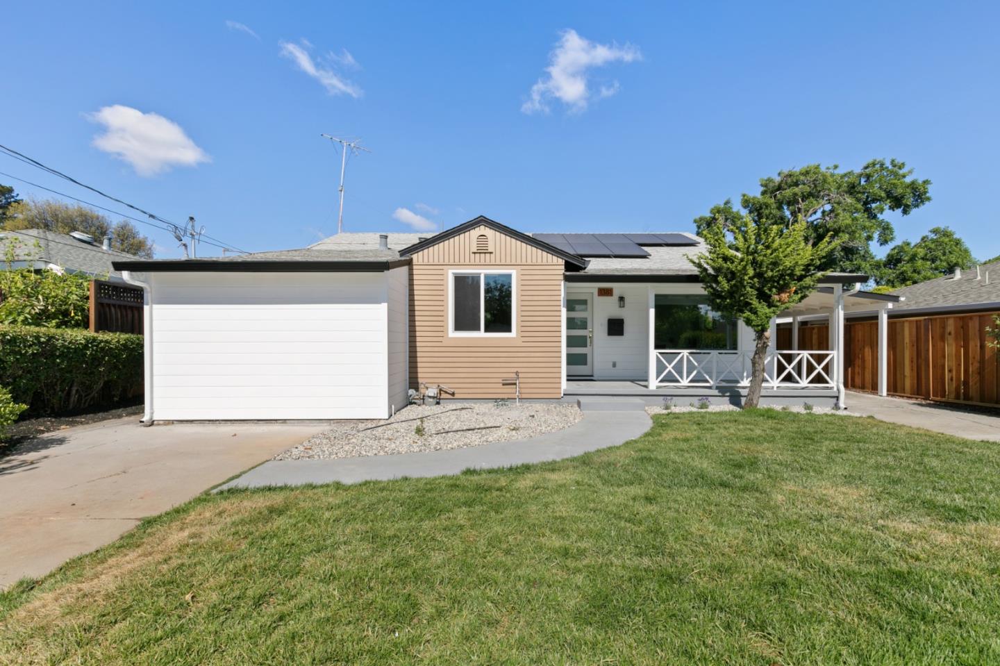 1381 Hampton Drive Sunnyvale, CA 94087 - Photo 2 of 28 a front view of a house with a yard and garage