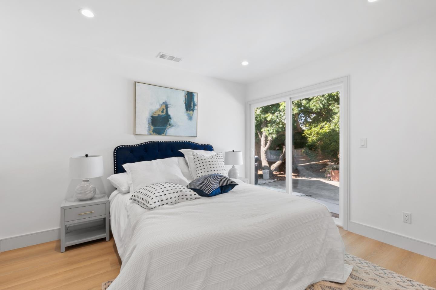 1381 Hampton Drive Sunnyvale, CA 94087 - Photo 21 of 28 a bedroom with a large bed and a window