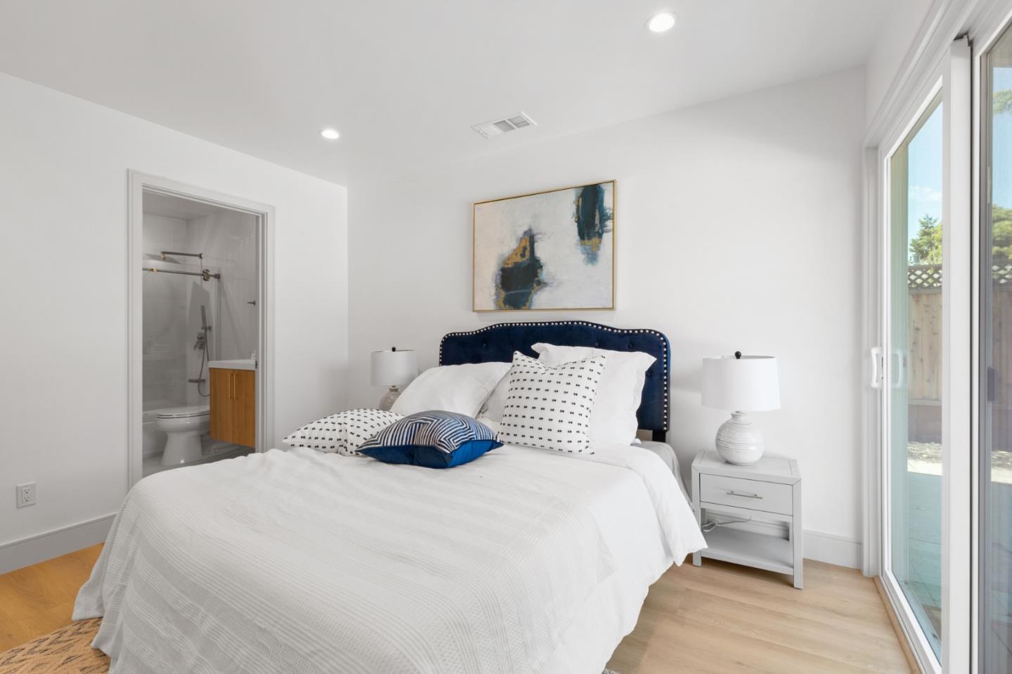 1381 Hampton Drive Sunnyvale, CA 94087 - Photo 22 of 28 a bedroom with a bed and a painting on the wall