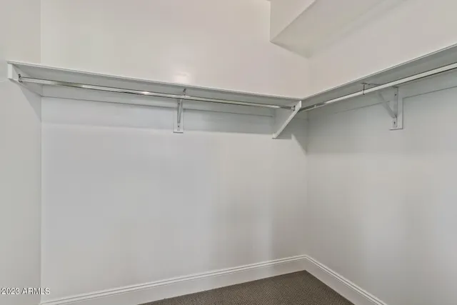 a view of an empty walk in closet