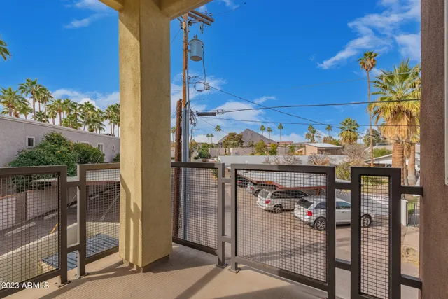 a view of a balcony with furniture