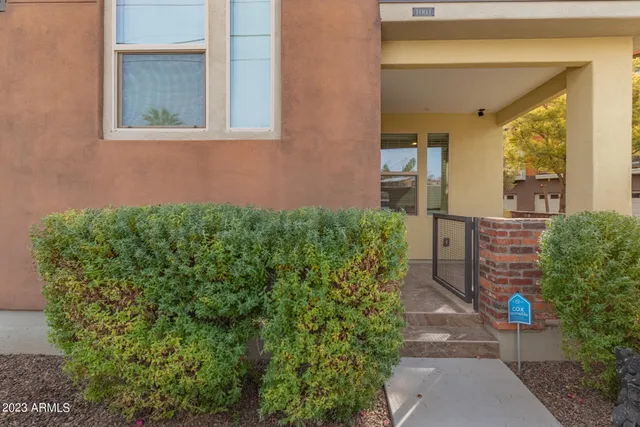 a view of a house with a flower garden