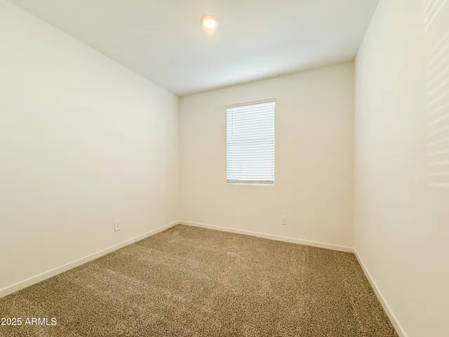 an empty room with a empty space and a window