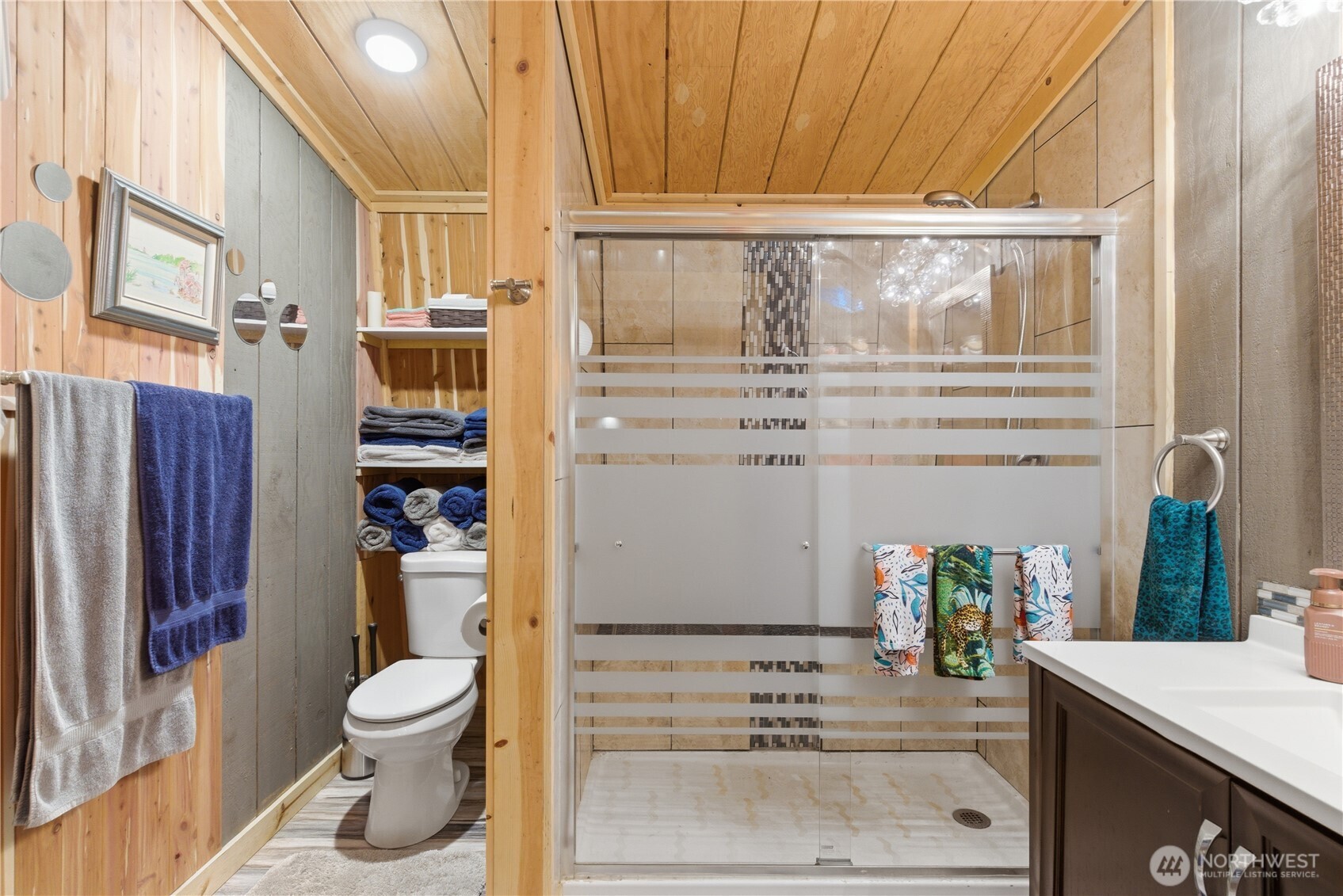 3320 Duckabush Road Brinnon, WA 98320 - Photo 21 of 38 a bathroom with a sink a toilet and shower