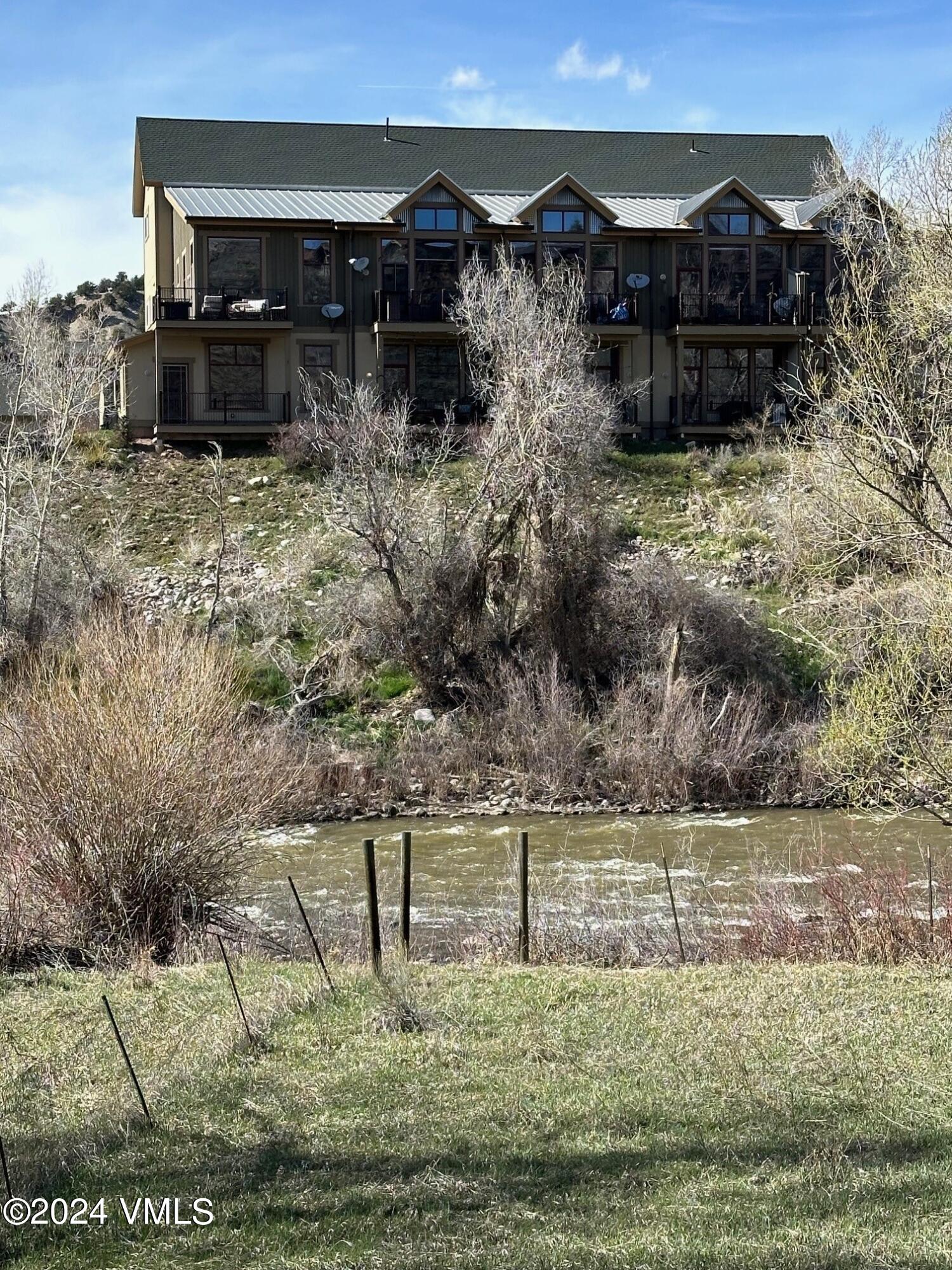 705 Nogal Road, Unit D6 Eagle, CO 81631 - Photo 3 of 15 a view of house with a yard