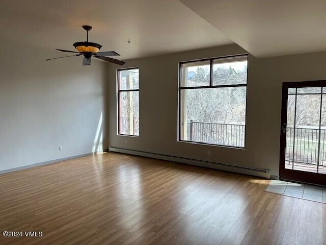 705 Nogal Road, Unit D6 Eagle, CO 81631 - Photo 7 of 15 an empty room with wooden floor and windows