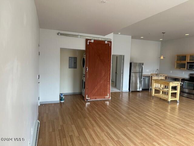 705 Nogal Road, Unit D6 Eagle, CO 81631 - Photo 10 of 15 a view of a kitchen with wooden floor and a refrigerator