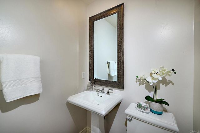 a bedroom with a bed and a ceiling fan