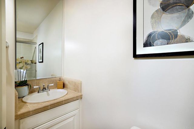 a white toilet sitting next to a bathroom