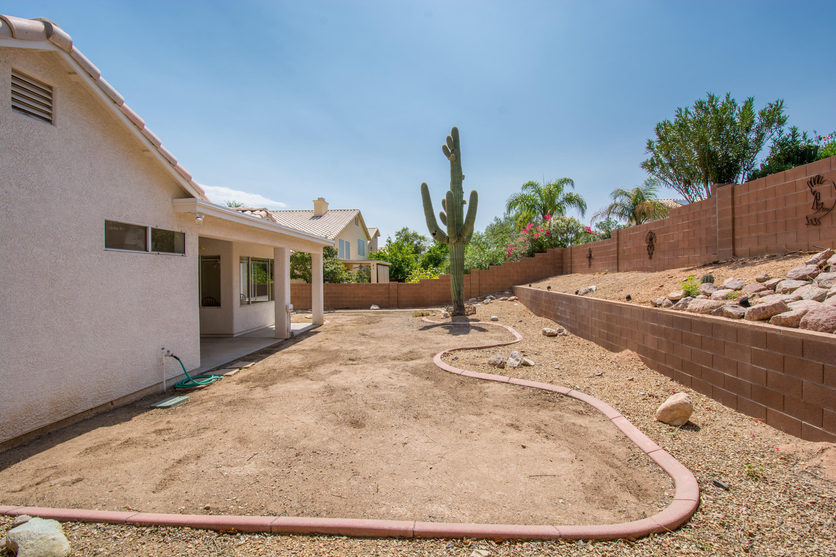 11341 Silver Pheasant Loop Oro Valley, AZ 85737 - Photo 26 of 41 a view of a house with a wooden floor