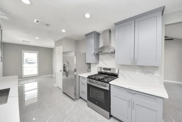 a view of an empty room with a bathroom