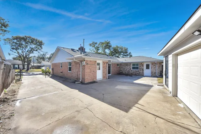 a view of backyard with a garden and deck