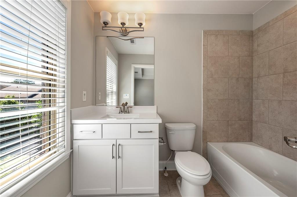2140 Coventry Drive Brookhaven, GA 30319 - Photo 18 of 29 a bathroom with a toilet a sink and bathtub