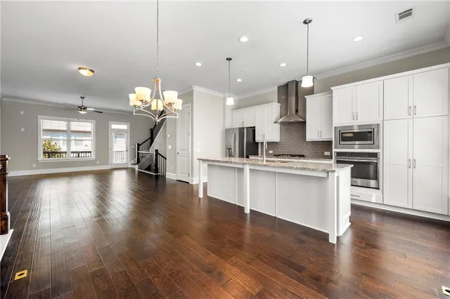 a view of kitchen with sink and wooden floor