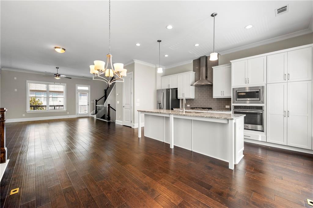 2140 Coventry Drive Brookhaven, GA 30319 - Photo 7 of 29 a view of kitchen with sink and wooden floor