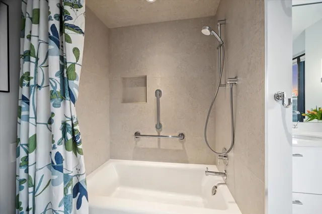 a spacious bathroom with a sink double vanity and a mirror